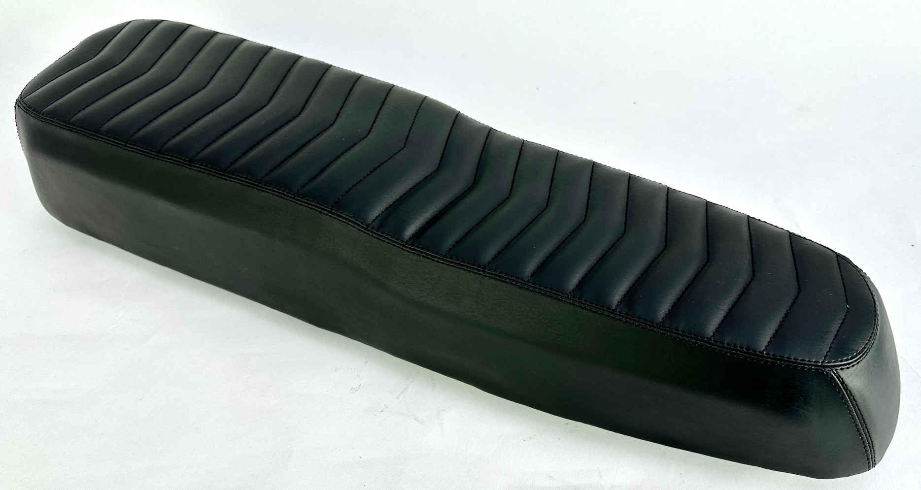 Black bench seat with quilted seams